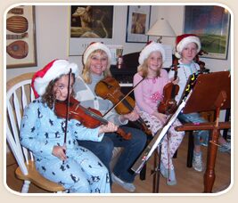 Charlotte Strings Academy students with violins in the studio