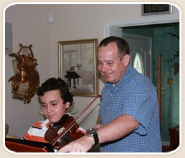 Peter Swic teaching a young violin student